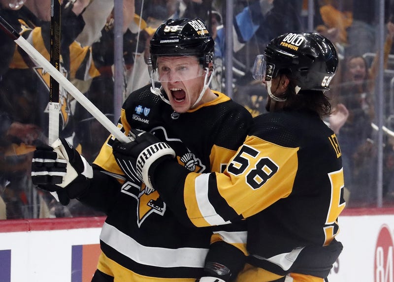 Jake Guentzel celebrates after goal