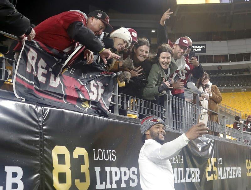 Kyler Murray taking a selfie with Cardinals fans
