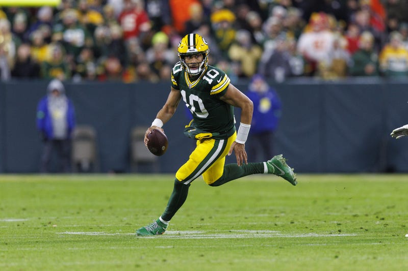 Dec 3, 2023; Green Bay, Wisconsin, USA; Green Bay Packers quarterback Jordan Love (10) rushes with the football during the second quarter against the Kansas City Chiefs at Lambeau Field.