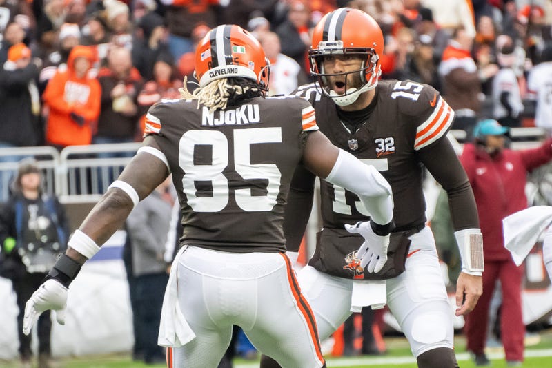 Cleveland Browns quarterback Joe Flacco (15) and tight end David Njoku (85) celebrate after Flacco threw a touchdown to Njoku during the first quarter against the Jacksonville Jaguars at Cleveland Browns Stadium. 