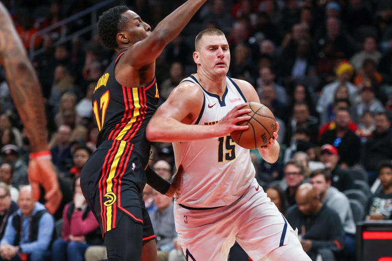 Denver Nuggets center Nikola Jokic drives past Atlanta Hawks forward Onyeka Okongwu