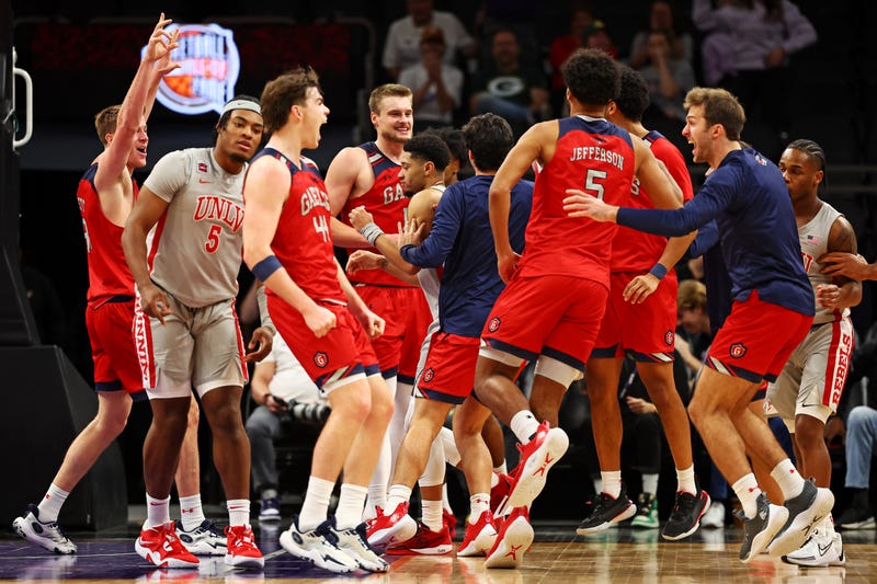 The St. Mary's Gaels celebrates after beating the UNLV Rebels in double overtime at Footprint Center.