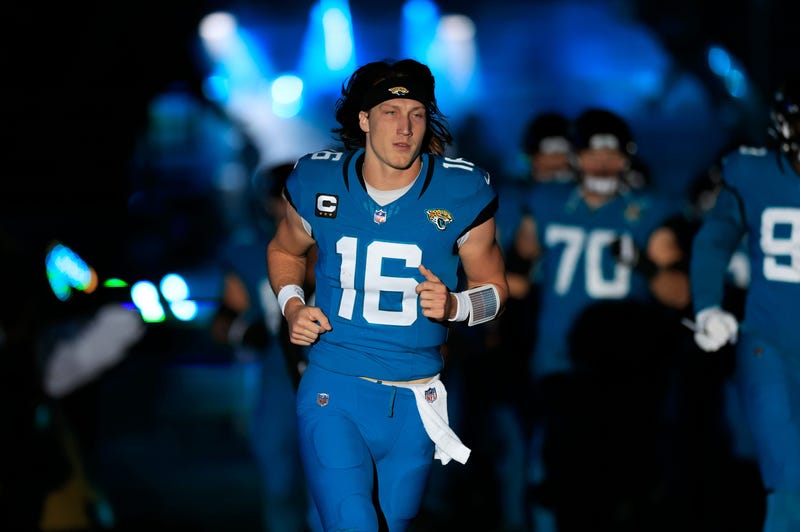 Jacksonville Jaguars quarterback Trevor Lawrence (16) runs onto the field before a game this season.