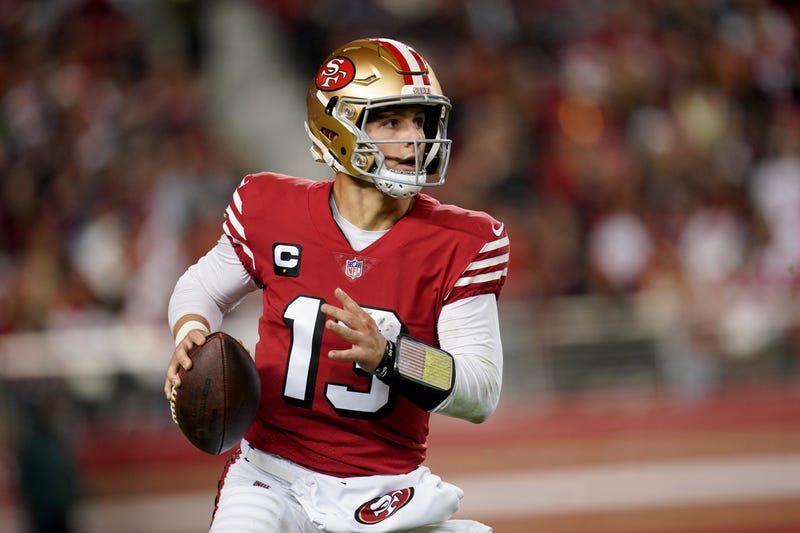 Dec 25, 2023; Santa Clara, California, USA; San Francisco 49ers quarterback Brock Purdy (13) runs the ball against the Baltimore Ravens in the fourth quarter at Levi's Stadium.
