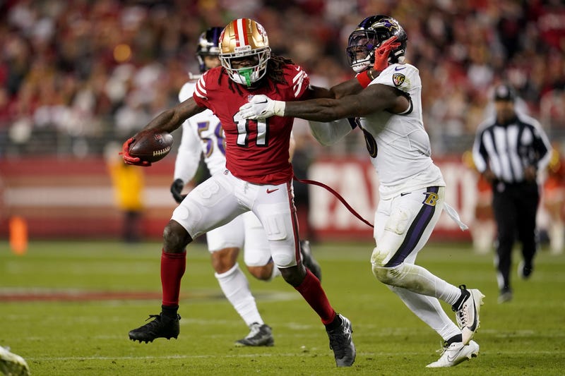 San Francisco 49ers wide receiver Brandon Aiyuk (11) runs with the ball next to Baltimore Ravens linebacker Patrick Queen (6) in the fourth quarter at Levi's Stadium.