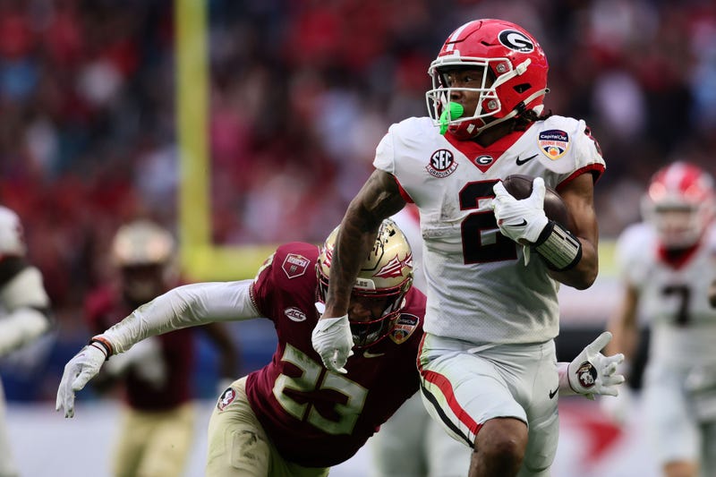 Dec 30, 2023; Miami Gardens, FL, USA; Georgia Bulldogs running back Kendall Milton (2) rushes the ball against the Florida State Seminoles during the first half in the 2023 Orange Bowl at Hard Rock Stadium. Mandatory Credit: Sam Navarro-USA TODAY Sports