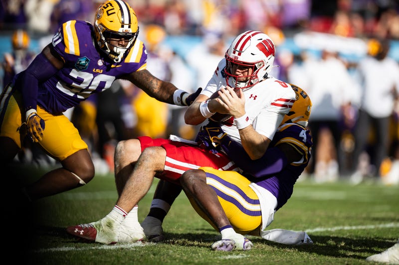 LSU Tigers linebacker Harold Perkins Jr. sacks Wisconsin Badgers quarterback Tanner Mordecai