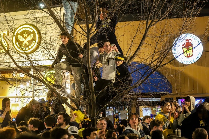 Michigan Wolverine fans take to the streets to celebrate their win at the College Football National Championship against Washington in Ann Arbor, Mich. on Monday, Jan. 8, 2024.