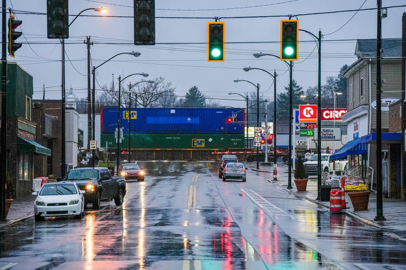 A Norfolk Southern train passes Market Street in downtown East Palestine on Wednesday, January 24, 2024