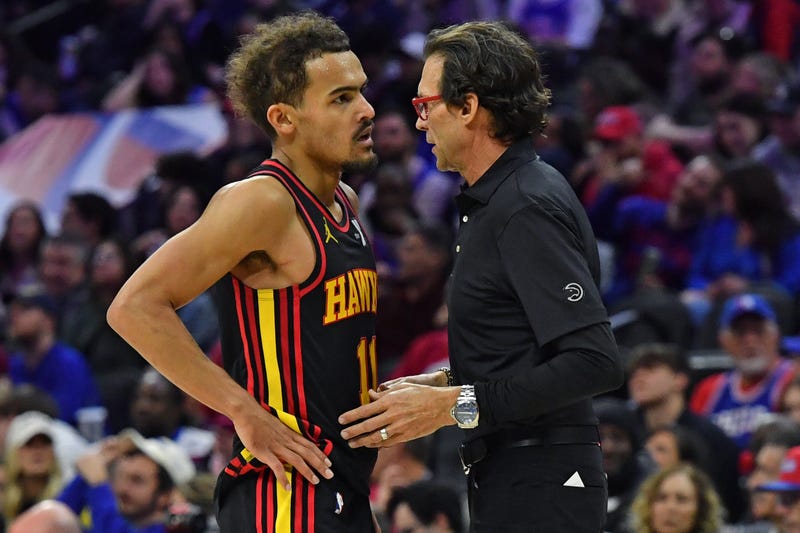 Feb 9, 2024; Philadelphia, Pennsylvania, USA; Atlanta Hawks head coach Quin Snyder talks with guard Trae Young (11) against the Philadelphia 76ers during the fourth quarter at Wells Fargo Center. Mandatory Credit: Eric Hartline-Imagn Images