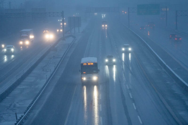 Morning commuters navigate the snow on the New Jersey Turnpike in Ridgefield on Feb. 13, 2024