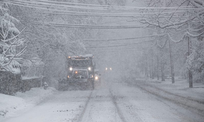 A snowplow clears snow along route 9 in Irvington, Westchester County, on Feb. 13, 2024
