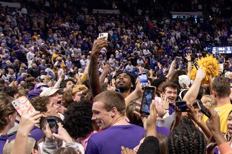 Former LSU Tigers and current Houston Rocket forward Tari Eason middle of screen takes a selfie as LSU Tigers defeat the Kentucky Wildcats