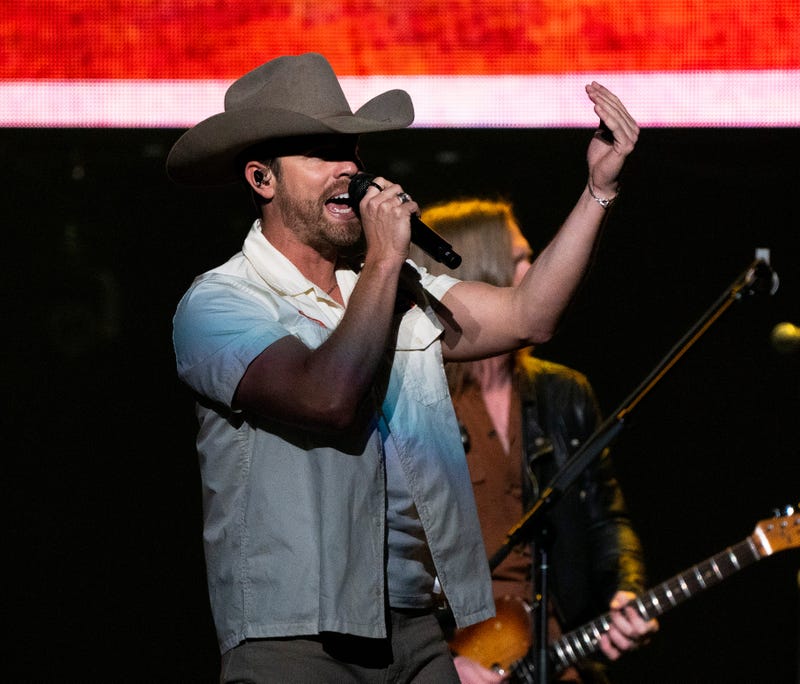 Dustin Lynch sings on stage