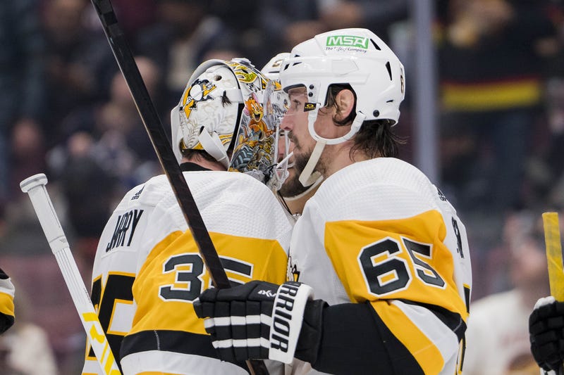 Erik Karlsson and Tristan Jarry in shot