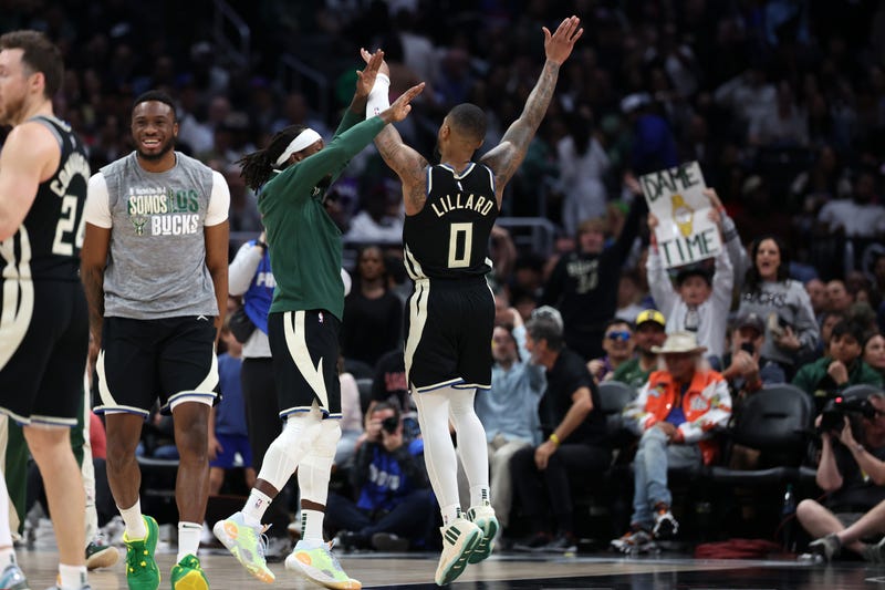 Mar 10, 2024; Los Angeles, California, USA; Milwaukee Bucks guard Damian Lillard (0) celebrates with teammates after making a three point basket in the fourth quarter against the Los Angeles Clippers at Crypto.com Arena. 