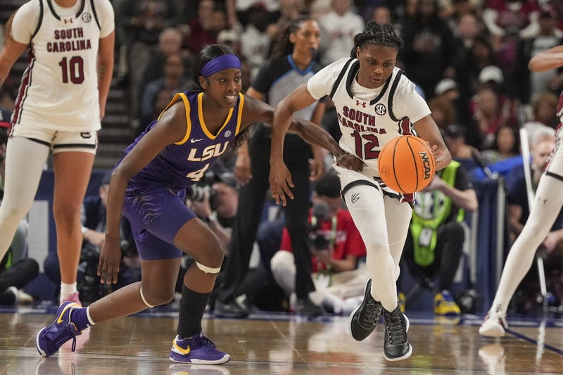 Mar 10, 2024; Greensville, SC, USA; South Carolina Gamecocks guard MiLaysia Fulwiley (12) steals the ball from LSU Lady Tigers guard Flau'jae Johnson (4) during the second half at Bon Secours Wellness Arena.