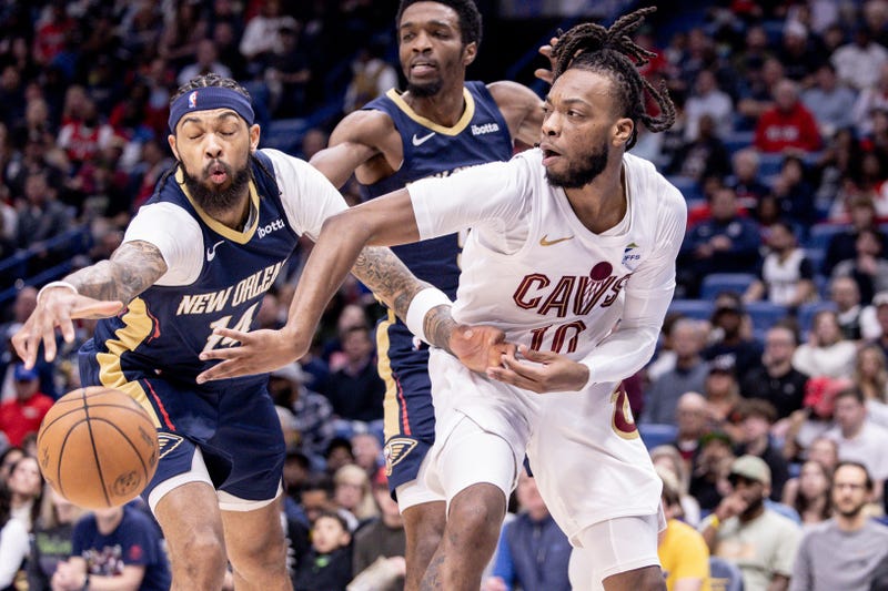 Cleveland Cavaliers guard Darius Garland (10) looks to pass the ball against New Orleans Pelicans forward Brandon Ingram (14) during the first half at Smoothie King Center.