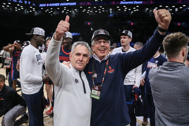 Keith Dambrot and Ken Gormley celebrating
