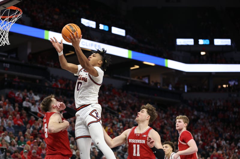 llinois Fighting Illini guard Terrence Shannon Jr. (0) goes to the basket over Wisconsin Badgers forward Tyler Wahl (5) in the second half at Target Center.