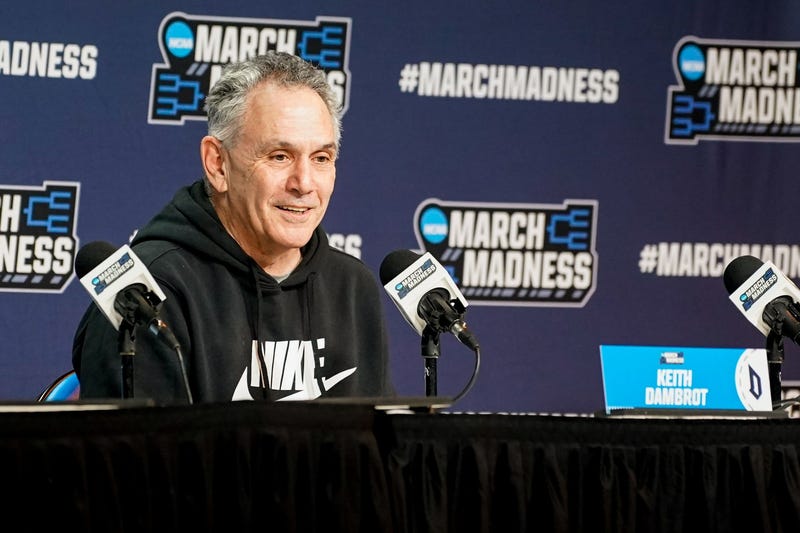 Keith Dambrot smiling at podium