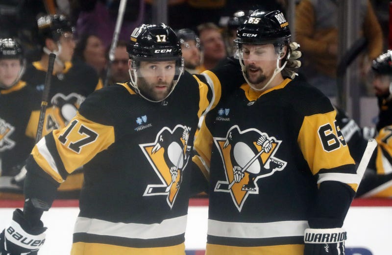 Bryan Rust celebrates with Erik Karlsson