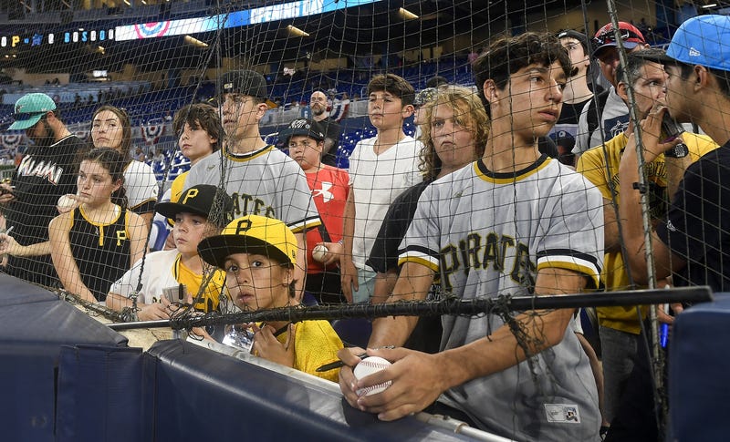 Pittsburgh Pirates fans watch their team warm up before playing the Miami Marlins,