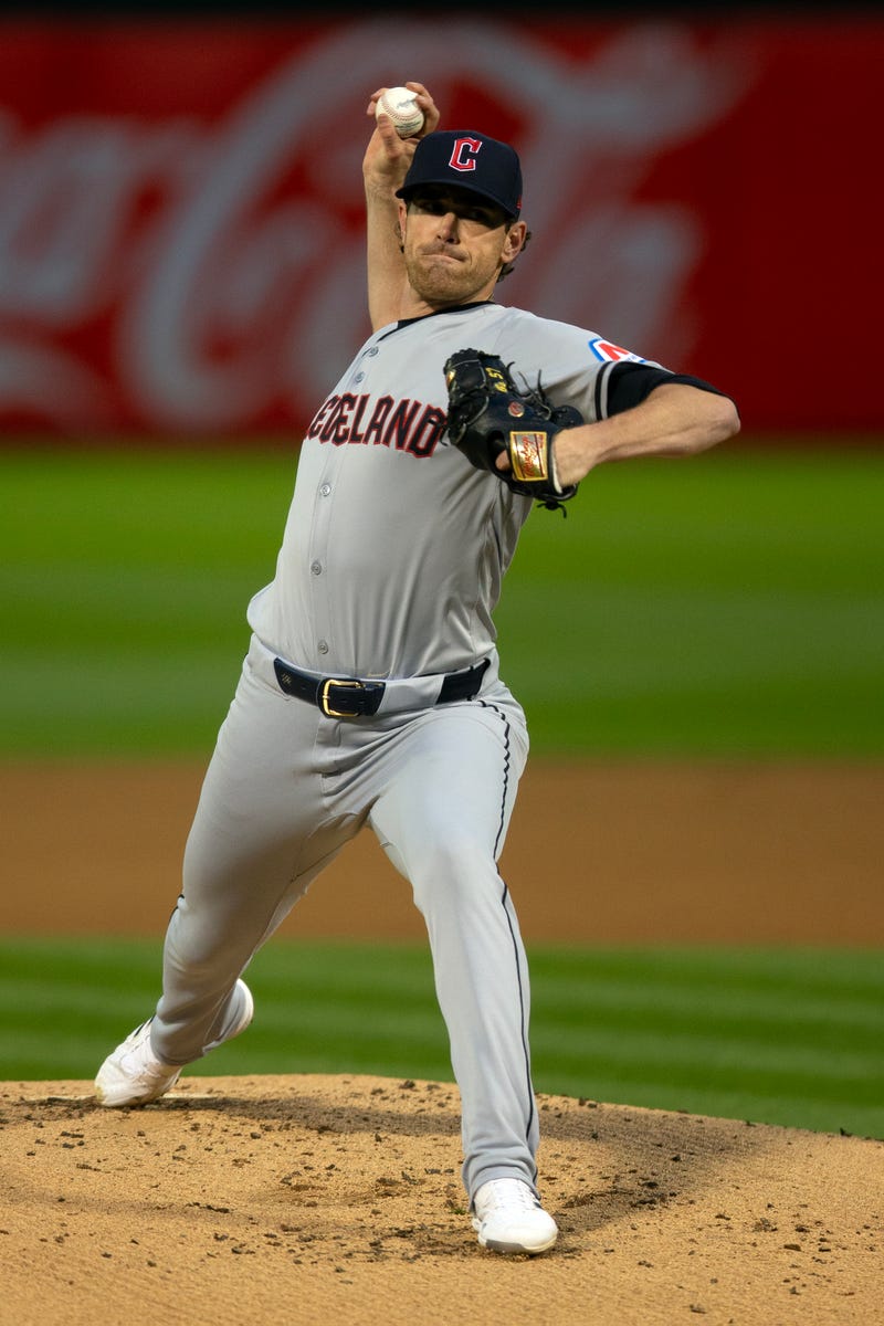 Mar 28, 2024; Oakland, California, USA; Cleveland Guardians starting pitcher Shane Bieber (57) delivers a pitch against the Oakland Athletics during the first inning at Oakland-Alameda County Coliseum.