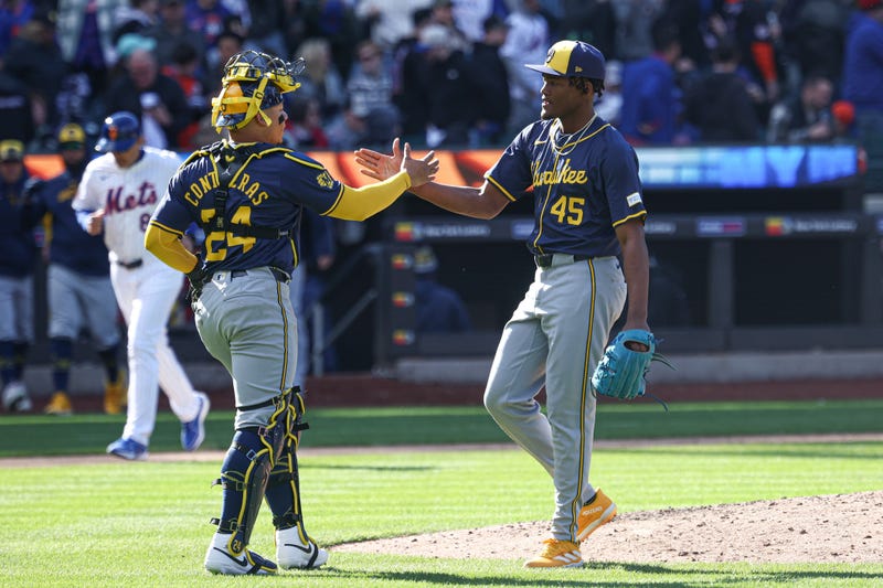 Milwaukee Brewers relief pitcher Abner Uribe (45) celebrates with catcher William Contreras (24) after defeating against the New York Mets