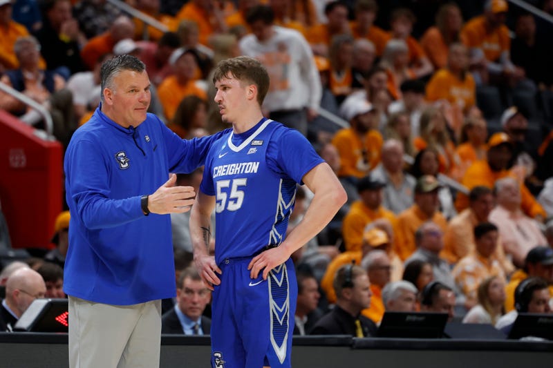 Creighton Bluejays head coach Greg McDermott talks with Creighton Bluejays guard Baylor Scheierman (55) in the first half during the NCAA Tournament Midwest Regional at Little Caesars Arena.