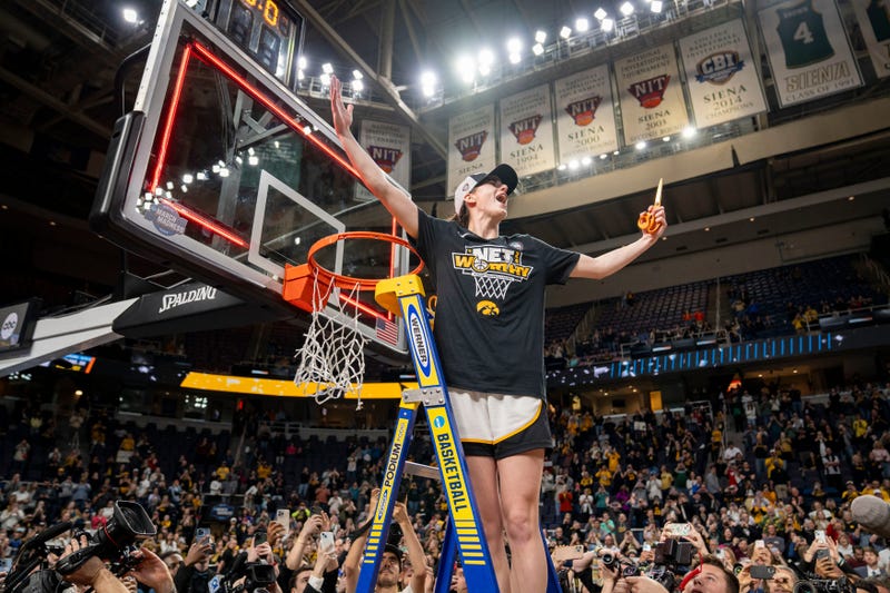 Iowa Hawkeyes guard Caitlin Clark (22) cuts down the net after beating LSU in the Elite 8 round of the NCAA Women's Basketball Tournament between Iowa and LSU at MVP Arena, Monday, April 1, 2024 in Albany, N.Y.