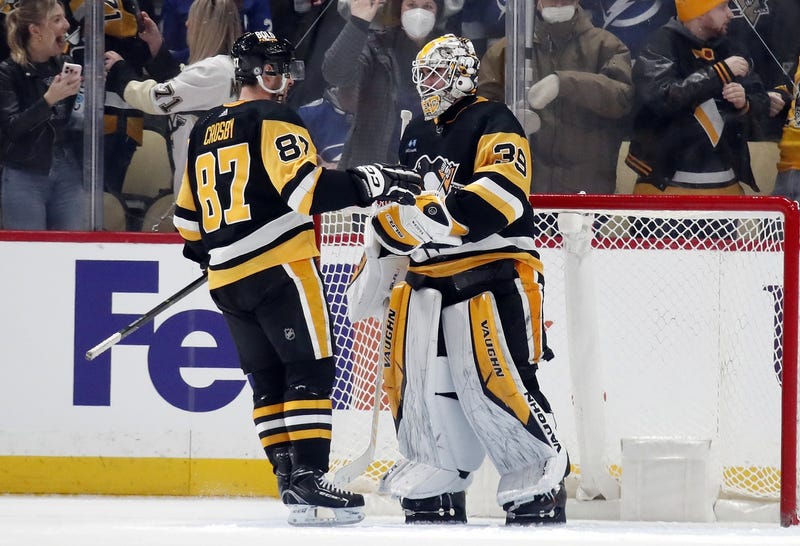 Sidney Crosby and Alex Nedeljkovic at net