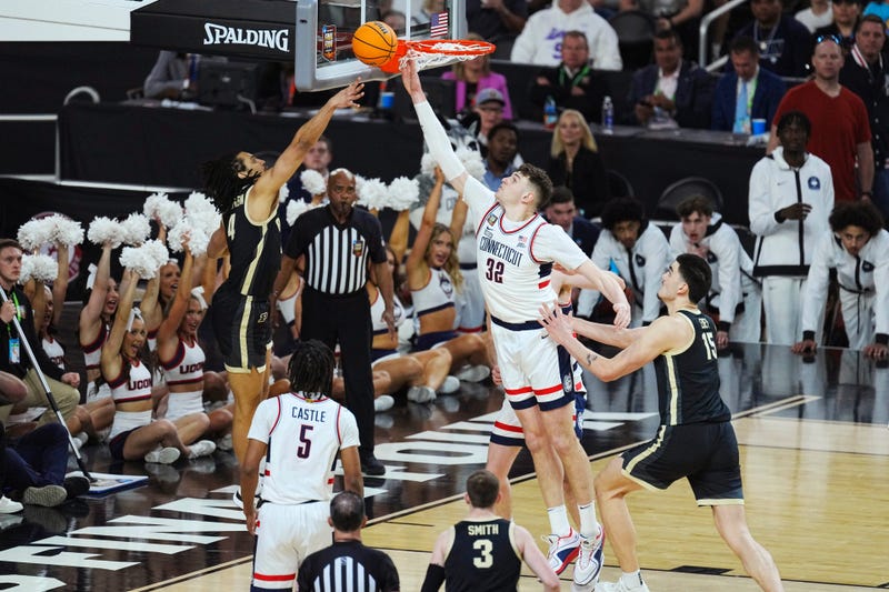 Connecticut Huskies center Donovan Clingan (32) blocks Purdue Boilermakers forward Trey Kaufman-Renn (4) in the first half in the national championship game of the Final Four of the 2024 NCAA Tournament at State Farm Stadium in Glendale on April 8, 2024.