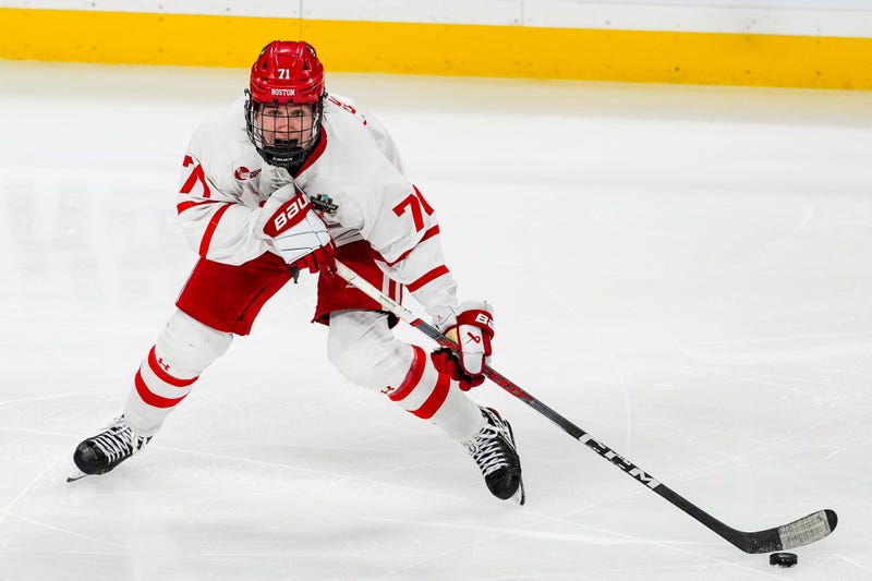 Apr 11, 2024; Saint Paul, Minnesota, USA; Boston U. forward Macklin Celebrini (71) carries the puck in the semifinals of the 2024 Frozen Four college ice hockey tournament during the third period against Denver at Xcel Energy Center.