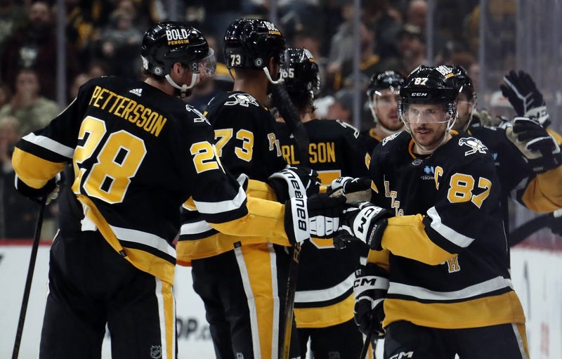 Sidney Crosby celebrating with teammates