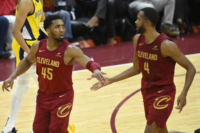 Apr 12, 2024; Cleveland, Ohio, USA; Cleveland Cavaliers guard Donovan Mitchell (45) and forward Evan Mobley (4) celebrate in the fourth quarter against the Indiana Pacers at Rocket Mortgage FieldHouse. 
