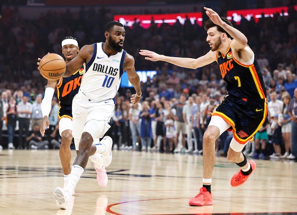 Dallas Mavericks forward Tim Hardaway Jr. (10) drives to the basket around Oklahoma City Thunder forward Chet Holmgren (7) during the first quarter at Paycom Center