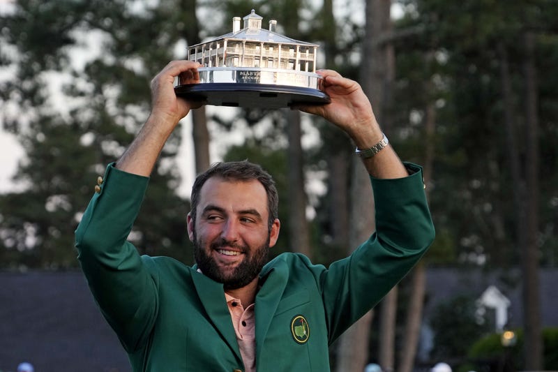 Scottie Scheffler poses with The Master Trophy after the final round of the Masters Tournament.