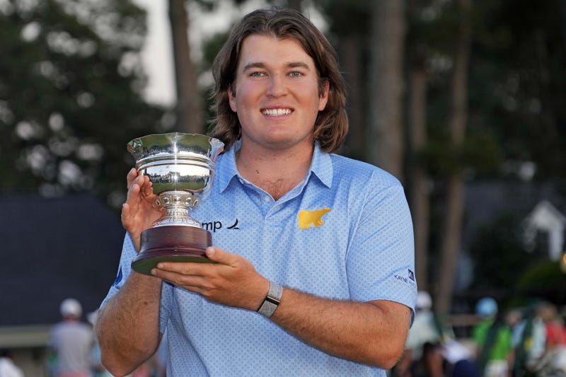 Neal Shipley holding trophy at Masters