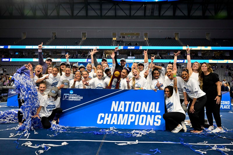The LSU Tigers gymnastics team celebrates after winning the national championship