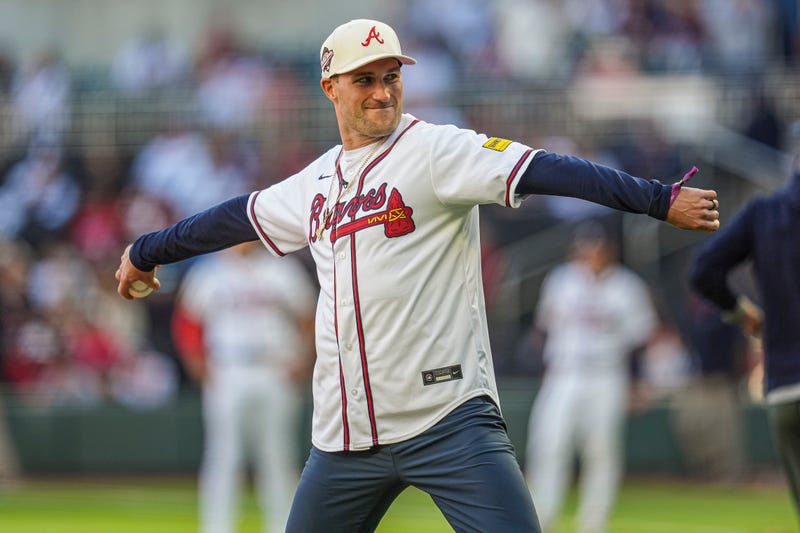 Atlanta Falcons quarterback Kirk Cousins throws out the first pitch prior to the game between the Atlanta Braves against the Texas Rangers at Truist Park.