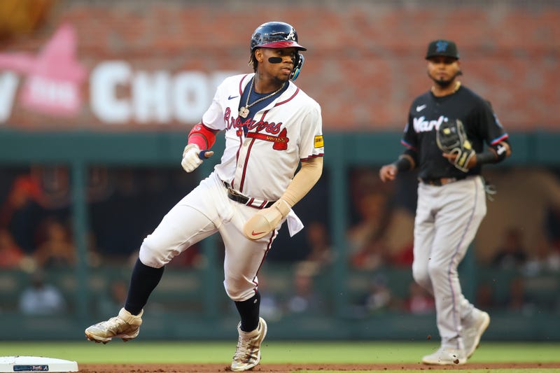 Apr 24, 2024; Atlanta, Georgia, USA; Atlanta Braves right fielder Ronald Acuna Jr. (13) steals second base against the Miami Marlins in the first inning at Truist Park. Mandatory Credit: Brett Davis-Imagn Images
