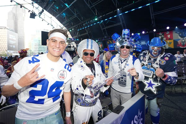 Dallas Cowboys fans posing at the NFL Draft