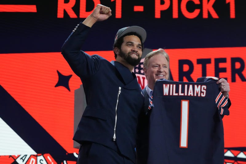 Caleb Williams poses with NFL commissioner Roger Goodell after being selected by the Chicago Bears