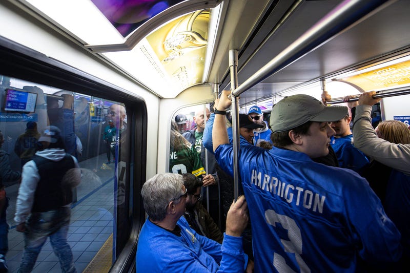 Detroit Lions fans on Detroit People Mover during NFL Draft