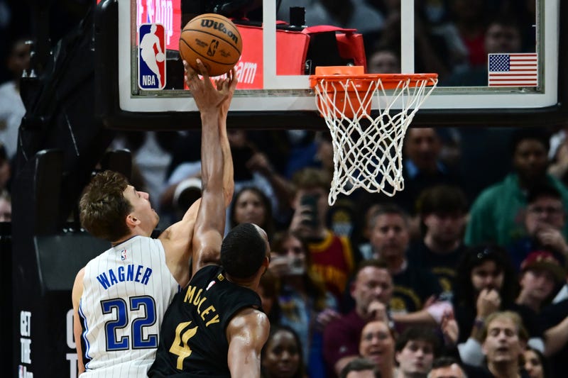 Cleveland Cavaliers forward Evan Mobley (4) blocks the shot of Orlando Magic forward Franz Wagner (22) during the fourth quarter in game five of the first round for the 2024 NBA playoffs at Rocket Mortgage FieldHouse. 