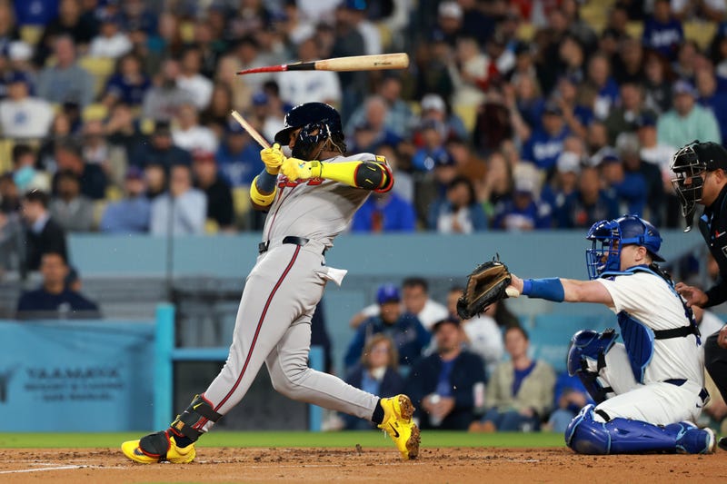 Atlanta Braves outfielder Ronald Acuna Jr. (13) breaks a bat in the third inning against the Los Angeles Dodgers at Dodger Stadium.