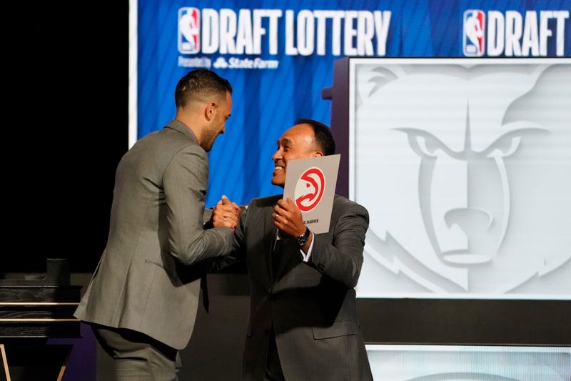 Atlanta Hawks general manager Landry Fields (left) and Mark Tatum Deputy commissioner of the NBA after the Hawks get the number one pick in the 2024 NBA Draft Lottery at McCormick Place West.