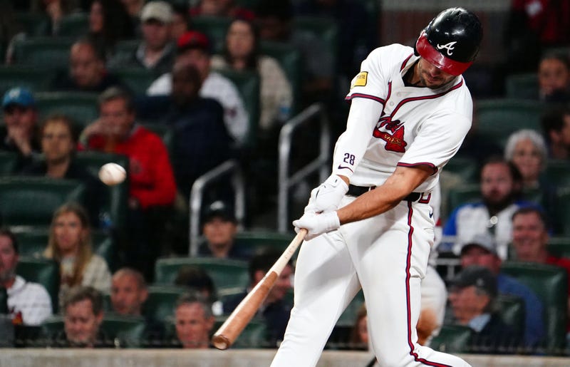 Atlanta Braves first base Matt Olson (28) hits against the Chicago Cubs during the seventh inning at Truist Park.