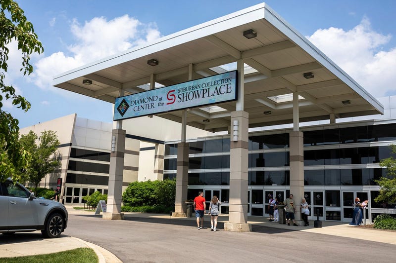 People walk inside the Suburban Collection Showplace